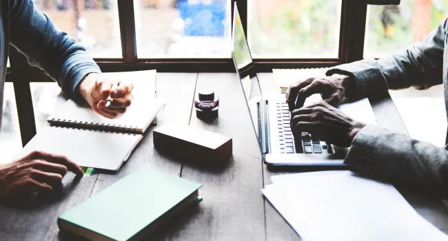 working at desk with laptop