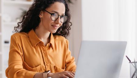 woman looking at laptop