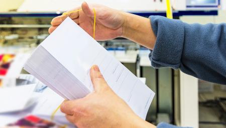 a man printing flyers